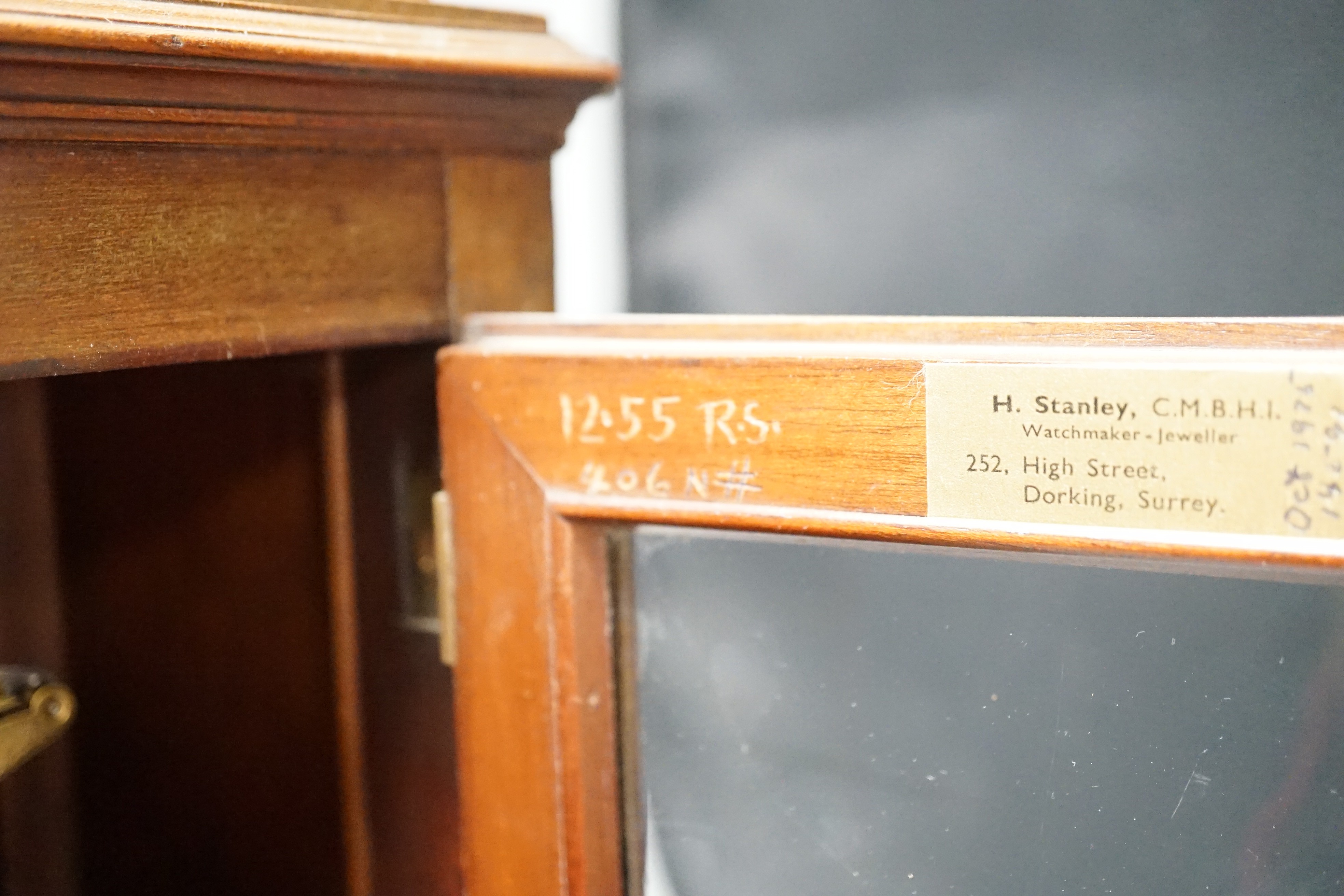 A Regency brass inlaid mahogany bracket clock, with pineapple finial, bears interior paper label Cuss & Co. 49cm high